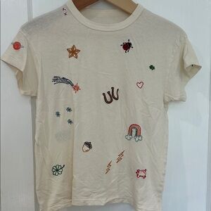 THE GREAT. Cream Short Sleeve Tee with Colorful Embroidered Motifs